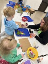 Young child building during hands-on STEAM play