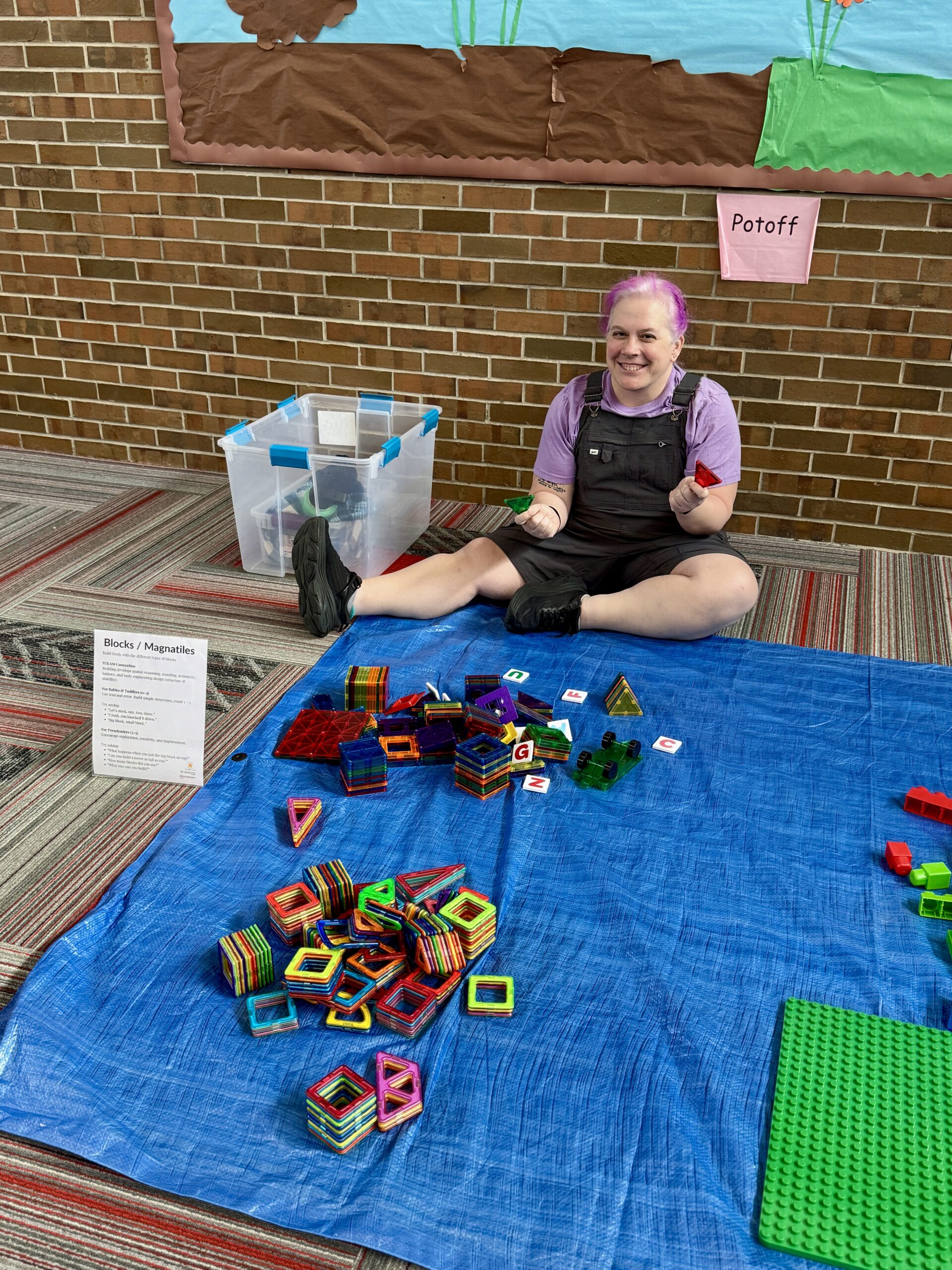 Community partner connecting with children through hands-on learning