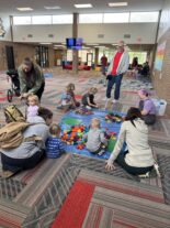 Young child exploring ramps and movement through play