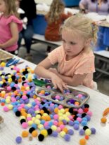 Families connecting with community resources at Little Explorers STEAM Night