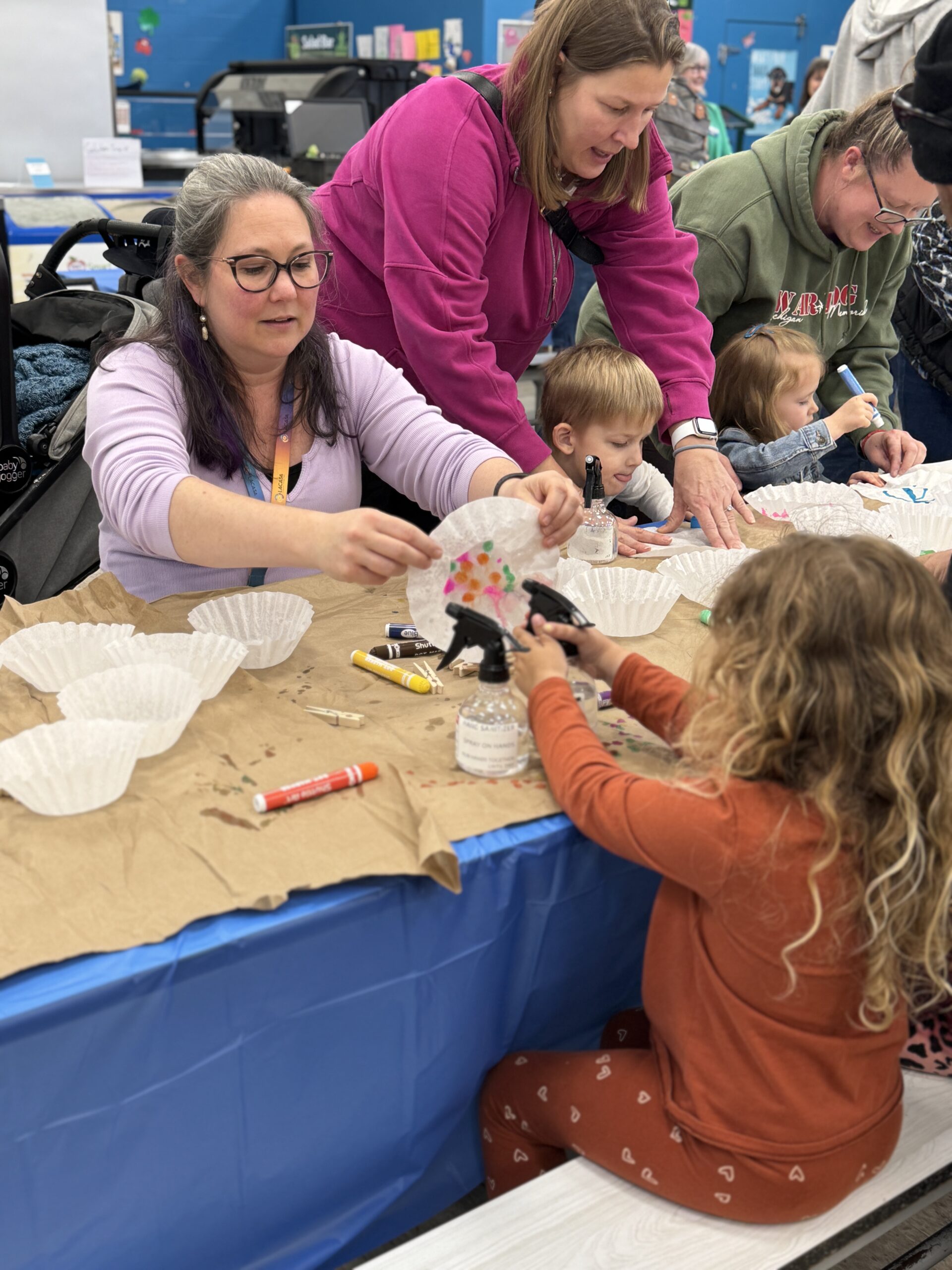 Young child experimenting during Little Explorers STEAM Night