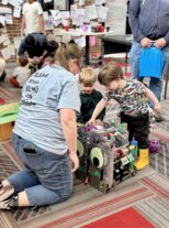 Livingston County family enjoying Little Explorers STEAM Night