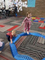 Young child learning through hands-on exploration