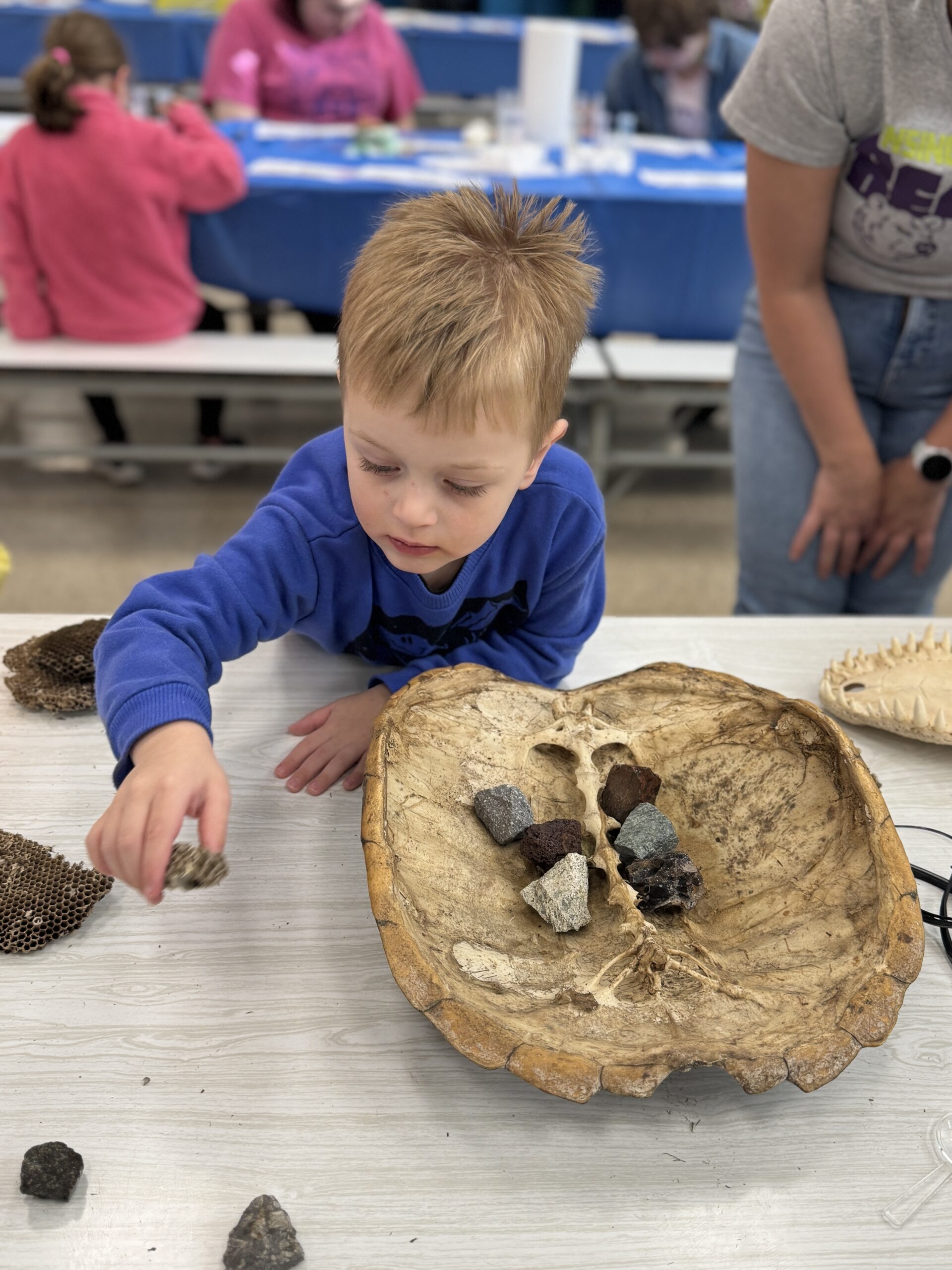 Young child exploring at Little Explorers STEAM Night