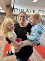 Family enjoying hands-on learning together at Little Explorers STEAM Night