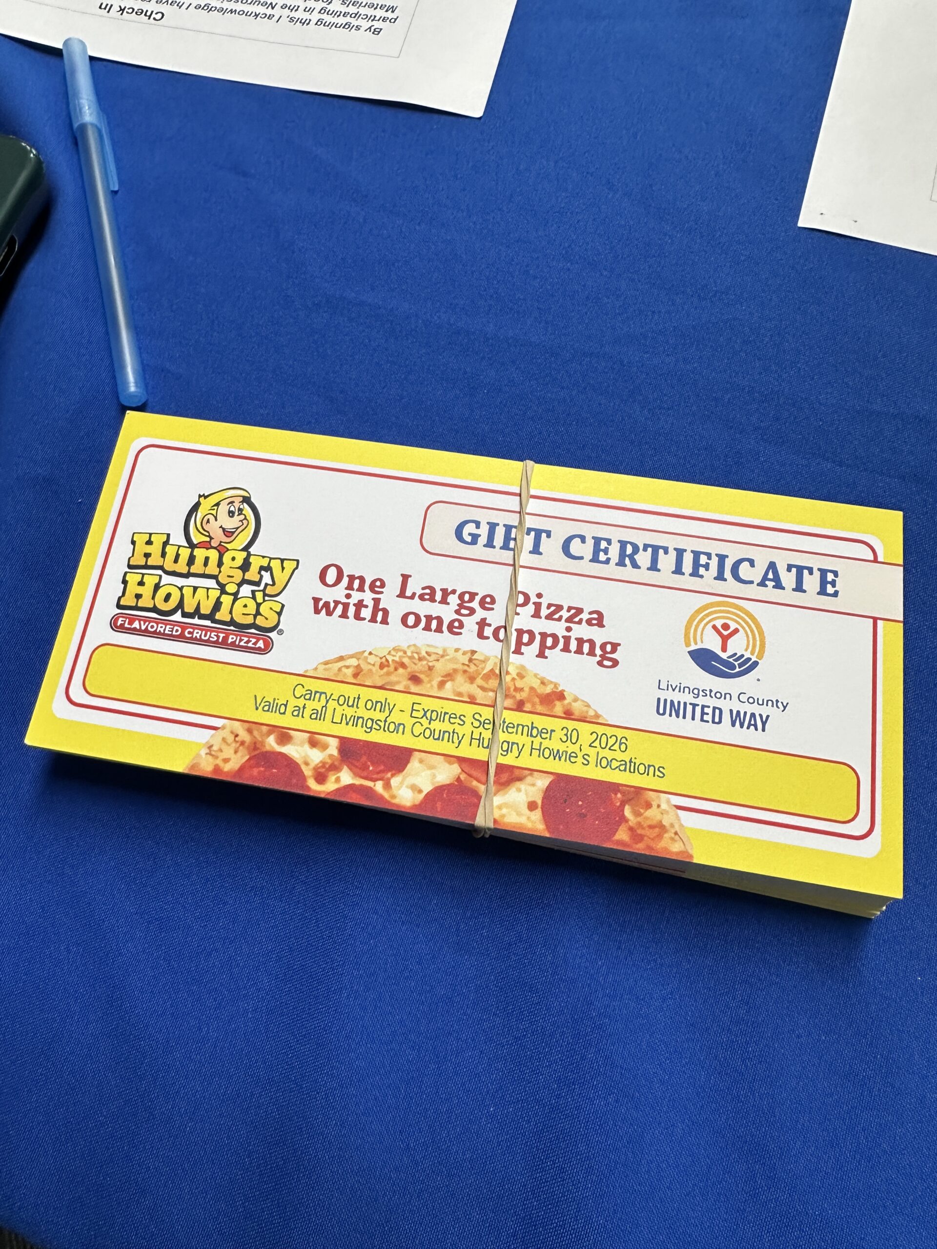 Hungry Howie's pizza certificates provided to Livingston County families through Livingston County United Way